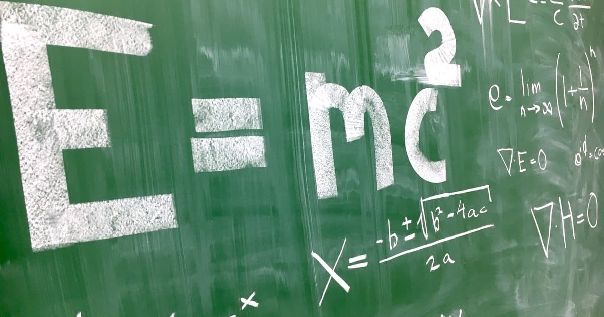 Chalk equations and formulas covering a green chalkboard